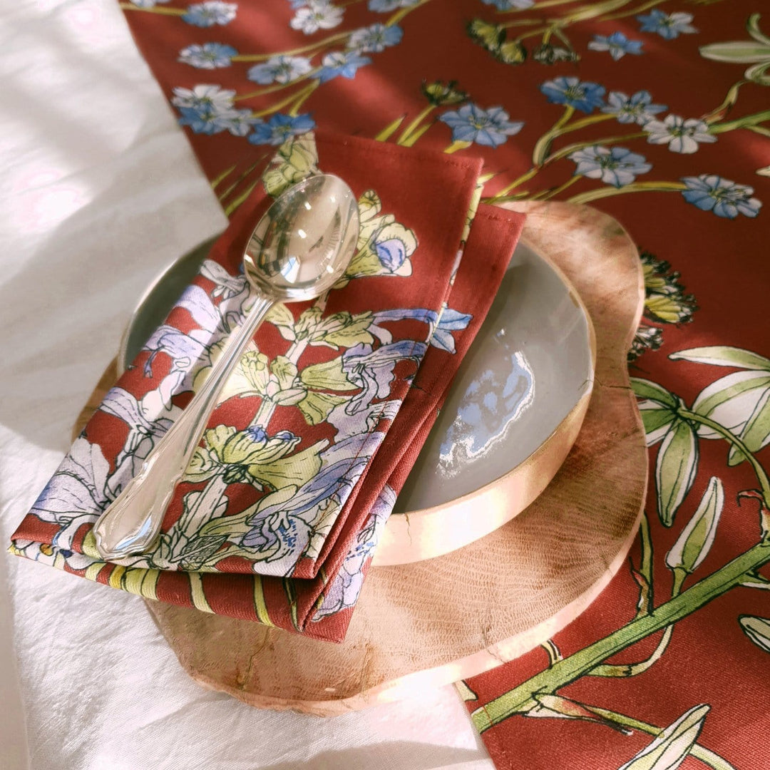 CoralBloom cotton napkin sets printed with Aristea on terracotta